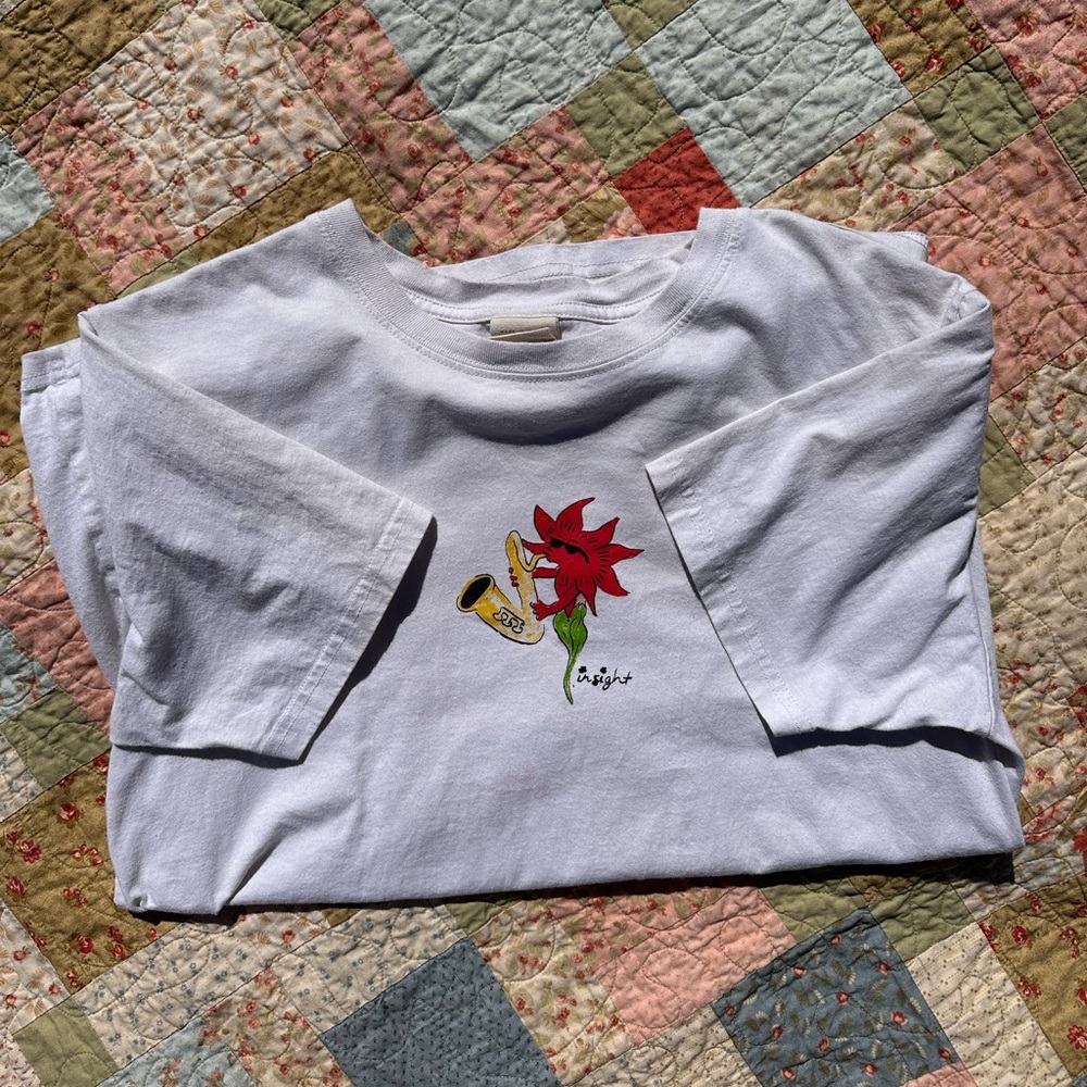 Flower playing Saxophone graphic tee
